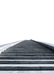 A long, straight staircase of light gray stone ascends into a black void