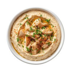 Creamy hummus topped with shredded chicken, herbs, and spices in a white bowl