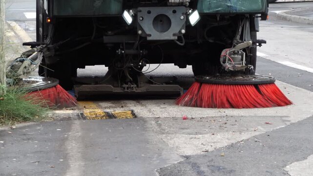Close up of a street sweeper machine cleaning the streets