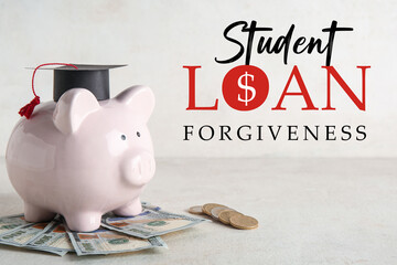 Piggy bank with graduation hat and money on light table. Student loan concept