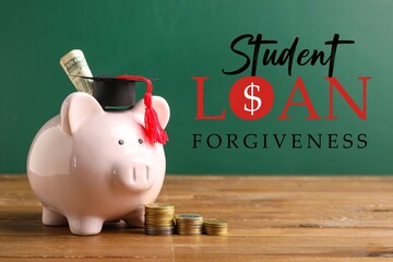 Piggy bank with graduation hat and money on table near green blackboard. Student loan forgiveness