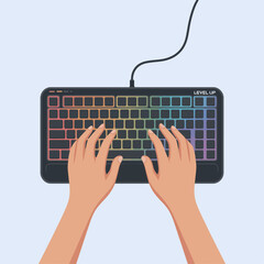 Overhead view of hands typing on a black computer keyboard with colorful rainbow backlighting on a light blue background.