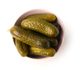 Bowl with delicious fermented cucumbers on white background