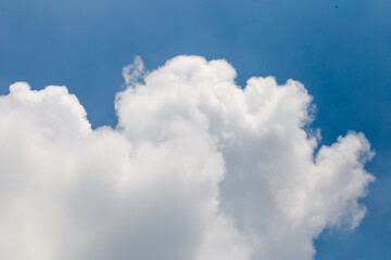 Layered Fluffy White Clouds Forming Depth in Blue Sky