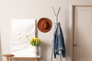 Modern interior of stylish hallway with clothes hanger