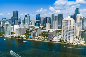 Fototapeta premium Drone view of Brickell skyscrapers. Brickell cityscape of downtown Miami. Panoramic Miami Brickell skyline above the coastline. Brickell Key aerial view in Miami. Landscape of Miami.