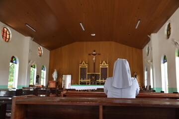 Landscape size picture of the interior of an empty roman catholic church