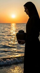 silhouette of a man on the beach, Woman stands on beach holding black ceramic urn with small plant. Serene beach scene with ocean waves, light blue sky. Peaceful memorial ritual with cremation ashes. 