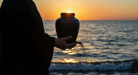 silhouette of a man holding a bottle of water, Woman stands on beach holding black ceramic urn with small plant. Serene beach scene with ocean waves, light blue sky. Peaceful memorial ritual with crem