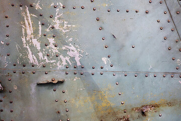 Close-up of the skin of an old abandoned plane.