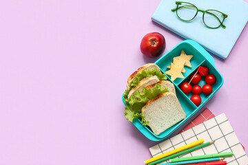 Lunch box with tasty food and school stationery on lilac background
