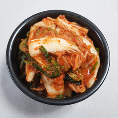 Fresh and Spicy Geotjeori Kimchi in a Black Bowl