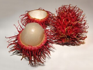 close up of delicious fresh ripe rambutan fruit on a table  in kauai, hawaii 