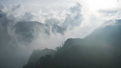 Fog flowing on hills and sky