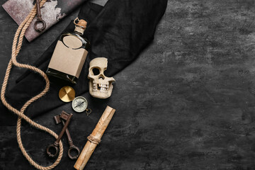 Skull with rum, compass, treasure map and rope on dark background. Pirate concept