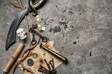 Pirate's items on grunge background, top view