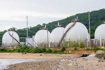Spherical Gas Storage Tanks by Coastal Landscape, Industrial Energy Facility on the Coastline, Petrochemical Storage Silos Near the Sea
