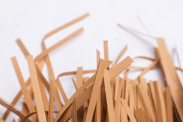 A close-up photo of brown shredded paper for packaging purposes.