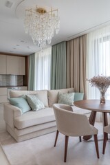 Elegant living room interior, featuring a cream sofa, crystal chandelier and wood table