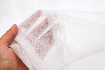 A Thin, Soft, and White Spun bond Fabric Wallpaper, Background, Backdrop, Texture.