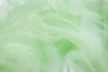 A close-up photo of beautiful, elegant, soft, detailed, textured, and wavy tulle fabric.