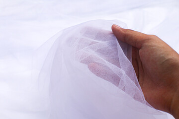 A close-up photo of beautiful, elegant, soft, detailed, textured, and wavy tulle fabric.