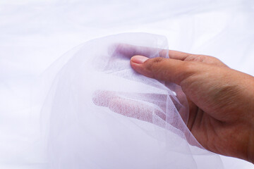 A close-up photo of beautiful, elegant, soft, detailed, textured, and wavy tulle fabric.