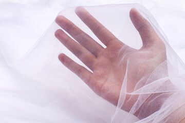 A close-up photo of beautiful, elegant, soft, detailed, textured, and wavy tulle fabric.