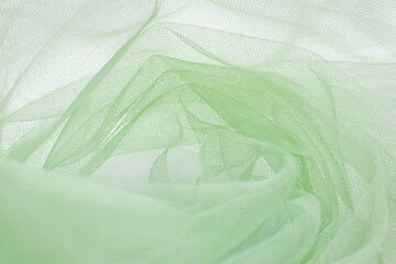 A close-up photo of beautiful, elegant, soft, detailed, textured, and wavy tulle fabric.