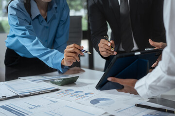 Entrepreneurs, marketers, managers, and financial analysts gather around the table to analyze data, present results, plan strategies, discuss efficiencies,grow their businesses through collaboration