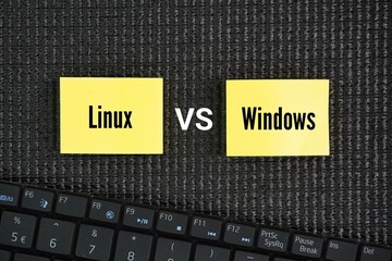 Laptop keyboard with two words linux vs windows. While Windows has long been a dominant player in...