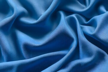 Fototapeta premium Blue sports fabric texture background, close-up of blue jersey cloth