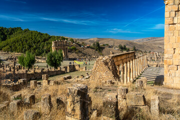 A striking low-angle shot showcases a series of remarkably preserved ancient Roman columns standing...