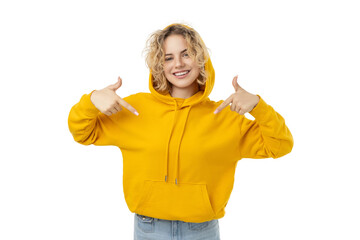 Happy woman in yellow hoodie points at herself, isolated on white, PNG