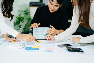 Young business creative team are brainstorming planning discussing while sitting in creative...