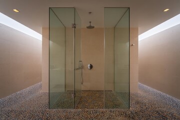 Modern Spa Bathroom with Double Glass Enclosed Rainfall Shower and Pebble Floor