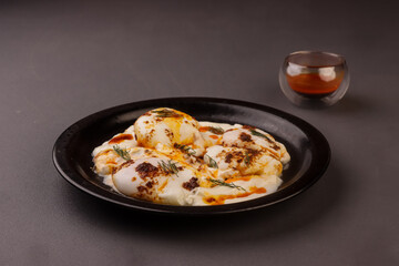 Cilbir or Turkish Eggs is Poached Eggs With Creamy Yogurt and Butter Sauce. 
