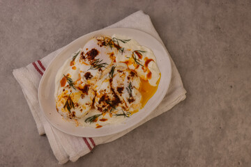 Cilbir or Turkish Eggs is Poached Eggs With Creamy Yogurt and Butter Sauce. 