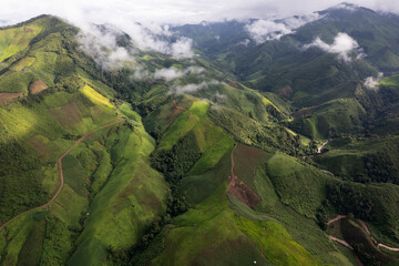 Landscape of Morning Mist with Mountain Layer. mountain ridge and clouds in rural jungle bush forest