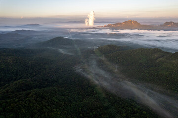 Landscape of Morning Mist with Mountain Layer. mountain ridge and clouds in rural jungle bush forest