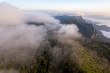 Landscape of Morning Mist with Mountain Layer. mountain ridge and clouds in rural jungle bush forest
