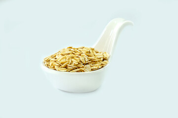Oatmeal in a bowl on a white background. Oatmeal in a cup. Contains antioxidants, which can help...