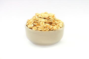 Oatmeal in a bowl on a white background. Oatmeal in a cup. Contains antioxidants, which can help reduce the risk of high blood pressure.