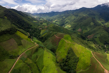 Landscape of Morning Mist with Mountain Layer. mountain ridge and clouds in rural jungle bush forest