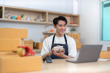 E-commerce entrepreneur packaging products in a bright workspace