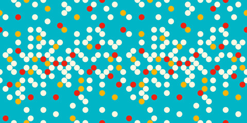 Colorful red, yellow, and white dots form a lively, evenly spaced pattern over a rich blue background. A cheerful geometric seamless pattern with playful energy and modern abstract appeal.