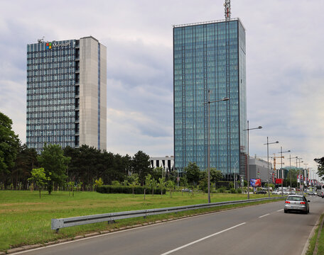 Belgrade, Serbia - April 09, 2025: Two Modern Glass Skyscrapers Usce park Towers Buildings With Tall Communication Antenna New Belgrade. Asphalt road with cars, transport. Microsoft brand logo