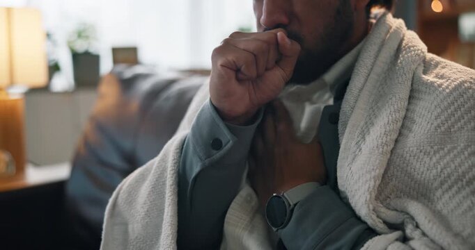 Chest pain, cough and man on sofa in home with heart attack, infection or cardiac arrest symptoms. Discomfort, sick and male person with tuberculosis or respiratory illness in living room at house.