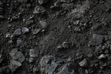 Background of black or dark gray rough soil 