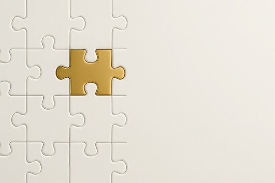 Golden puzzle piece perfectly fitting into a white puzzle structure on a clean background - symbol of perfect match, premium solution, and exclusive fit, with copy space.